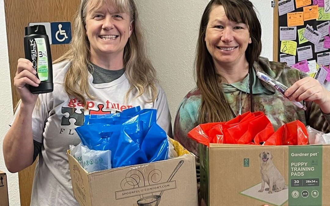 That's our amazing volunteer Kelly on the left, delivering hygiene care kits to West Glacier Elementary!