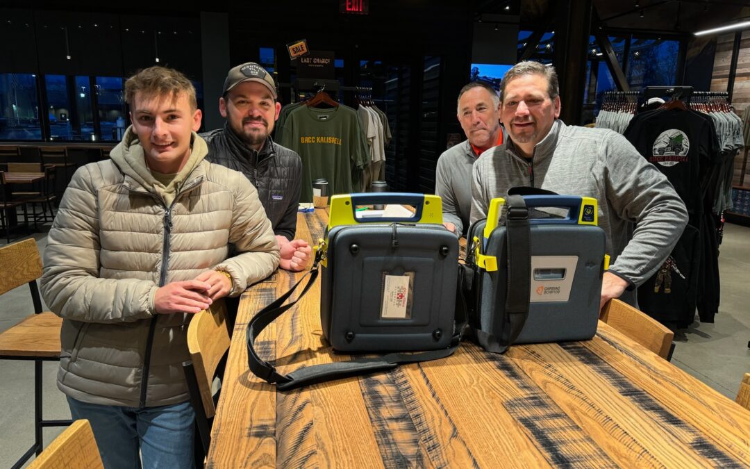 Tucker delivers two new AED units to Flathead Valley Little Guy Football!