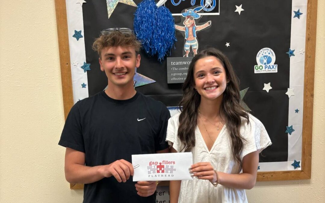 Gap Fillers Flathead Student Ambassadors Tucker and Tailyr present a check to Cayuse Prairie School to clear student lunch debt.